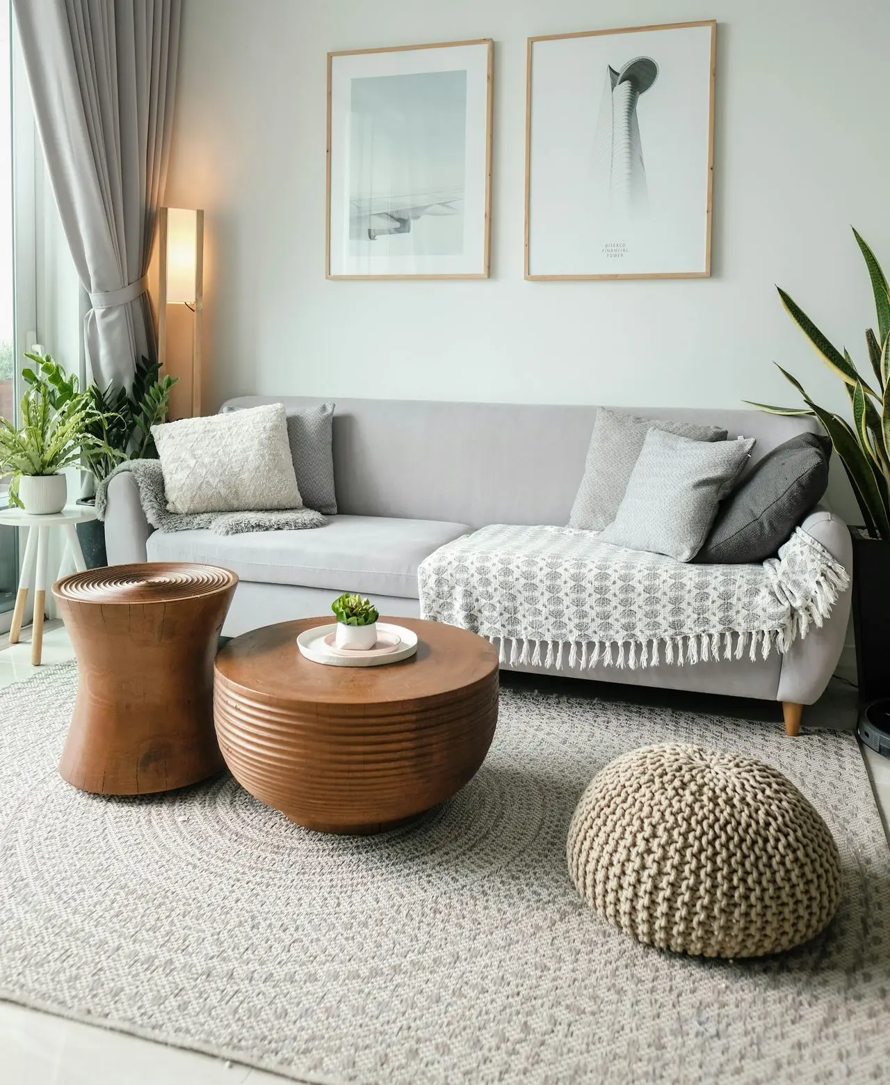 a living room filled with furniture and a large window