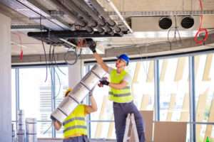 Worker making an HVAC air duct